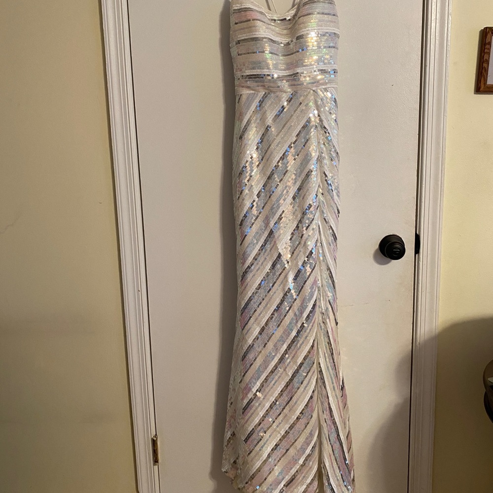 Size 4 Deja Vu prom dress. Worn twice. Iridescent color